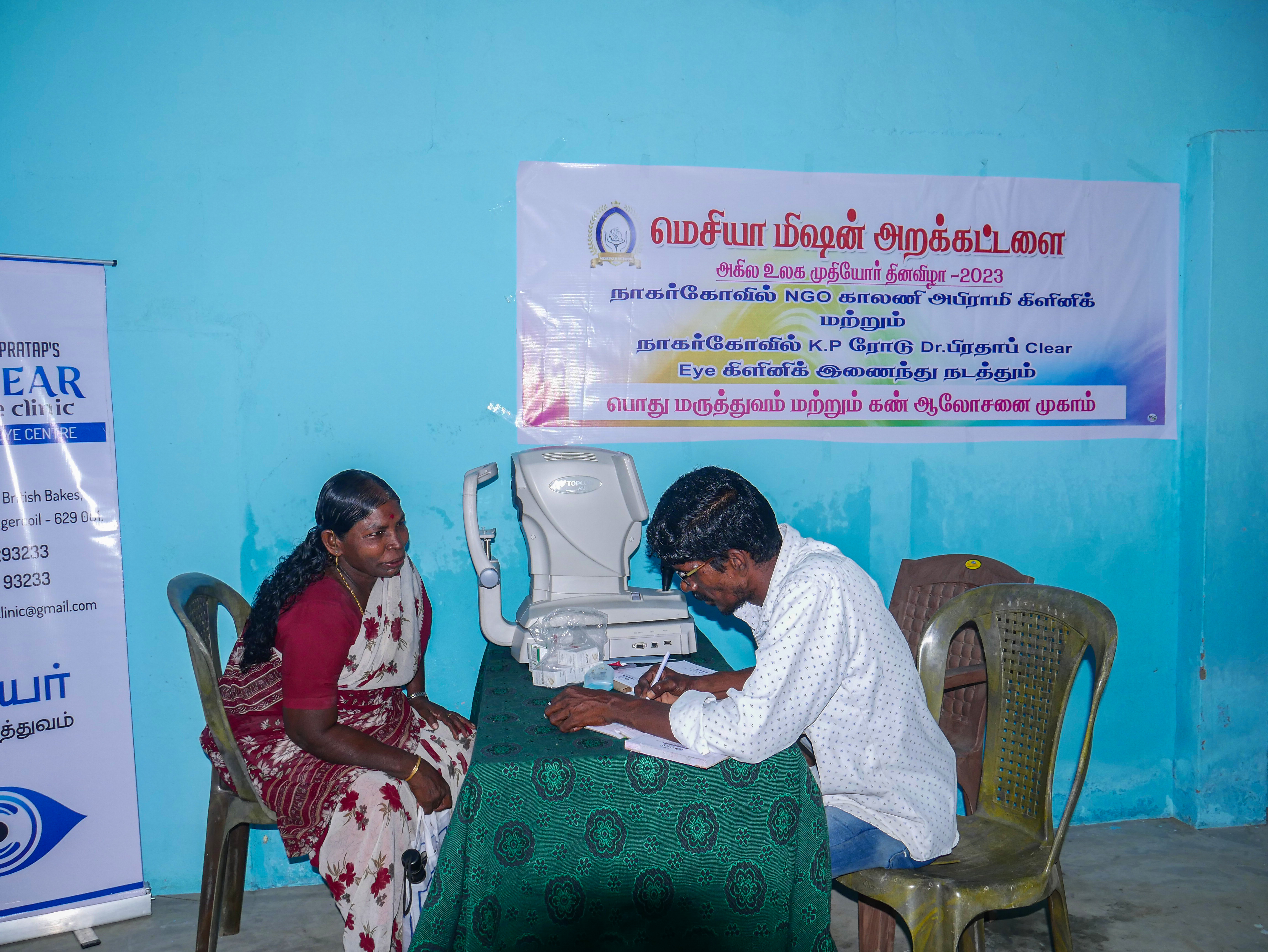 Elderly resident receiving professional eye testing