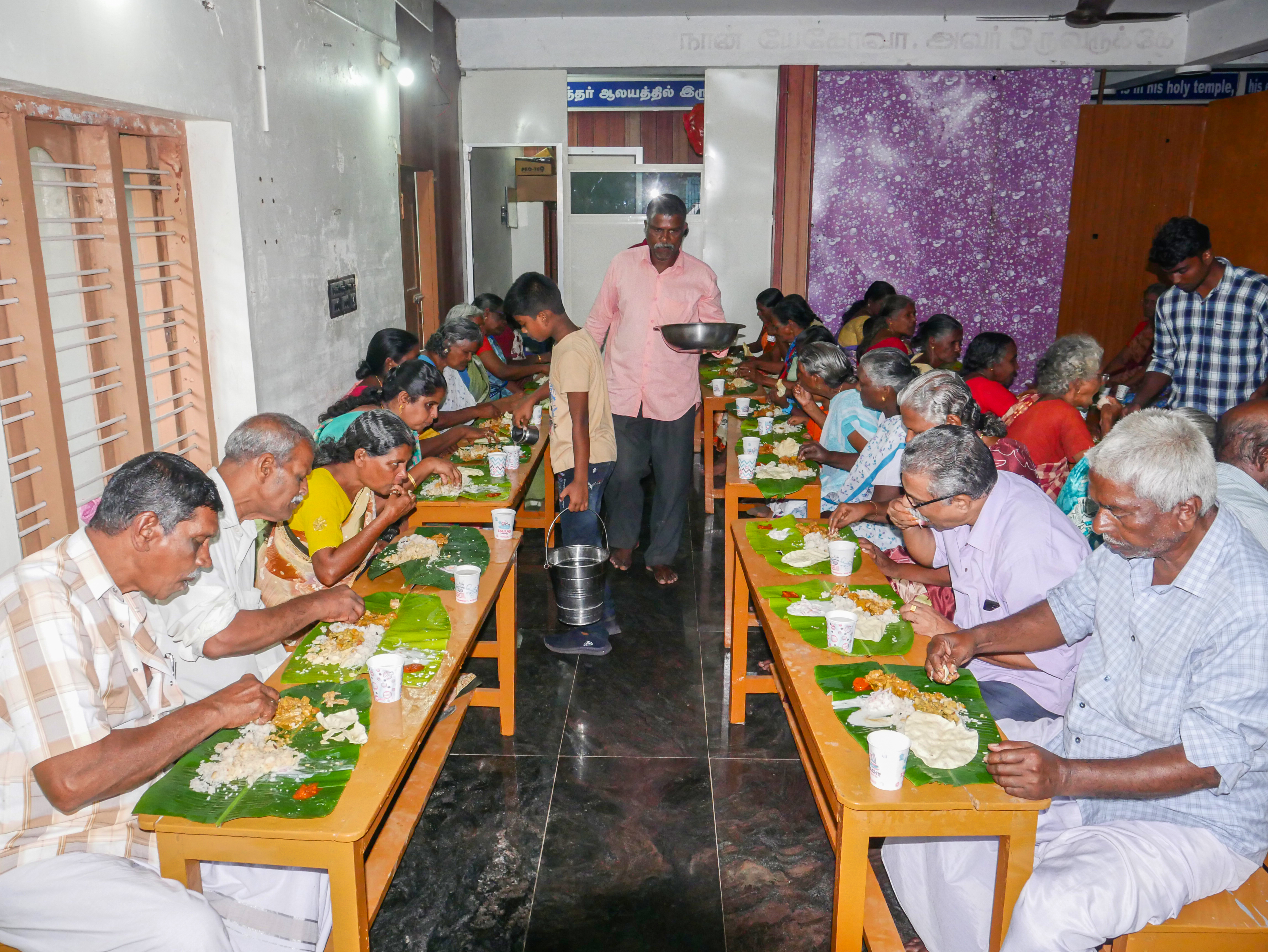 Seniors enjoying community meal at Messiyah Mission Elders Home